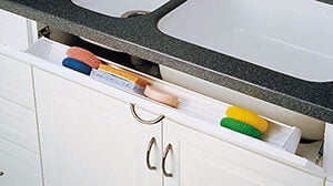 Tilt out sink drawer